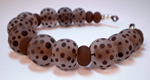 Unique Tamarind core encased with Effetre Clear and dotted with Adamantium; Mink spacers