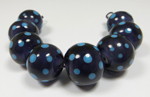 core of Effetre white encased with African Violet, with Aloha dots