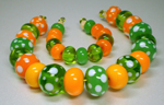 Messy Creamsicle & Poison Apple paired with Effetre Lime transparent and dotted with Effetre white