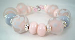 Messy Desert Pink encased with Crystal Clear and dots of Effetre Pearl Gray