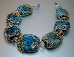 Hades with Double Helix silver infused frit encased in Effetre clear