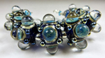 Messy Neon Blue Ltd Run with dark ivory, Trade Winds, Trautman's JD Mix, encased in clear with dots of DH Triton