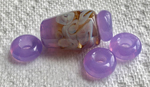 For these beads, CiM's Lavender Water Ltd Run was the base of the centre of the focal faux vessel with CiM's Wisteria Ltd Run shoulders. Mixed Double Helix silver glass was swirled and encased with clear. The spacer beads are CiM's Wisteria Ltd Run.