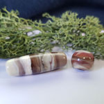 Long bead – base of various neutral colour glasses with wraps of Chocolate. Smaller bead is all CiM colours as a base with Chocolate and Watermelon wrapped around.