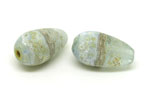 Pachamama combined with Effetre baby blue, a bit of silver foil on the blue, fine raku powder aged with baking soda.
