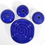 				Top left to right: bead encased with clear, non-encased bead, etched bead