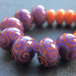 Effetre opaque Periwinkle 220 encased in Effetre transparent Medium Amethyst 042 with CiM Harvest stringerwork and spacers
