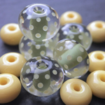 These beads are Weeping Willow with a heavy encasing layer of Effetre Super (Crystal) Clear 006 and polka dots and spacers in Baked Alaska.