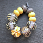The beads here are CiM Koala encased with CiM Moonlight with decoration and spacers in Yellow Brick Road.