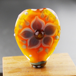 "This bead has Kniphofia in the core, encased with Scotch Broom."