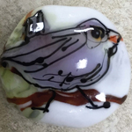 Base is Effetre white encased with Peppermint Cream, Wisteria body, Alley Cat eye & beak, Anole leaves